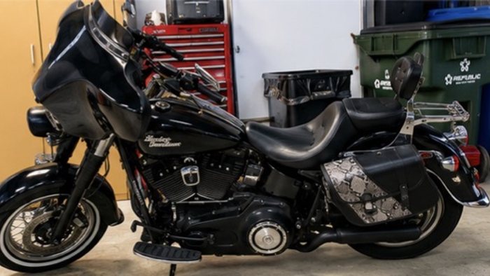 Black Harley-Davidson touring motorcycle hand detailed from tank to tires